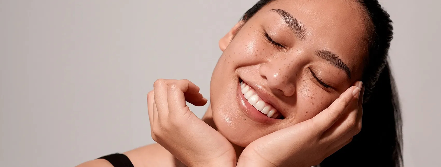 Woman smiles after facial