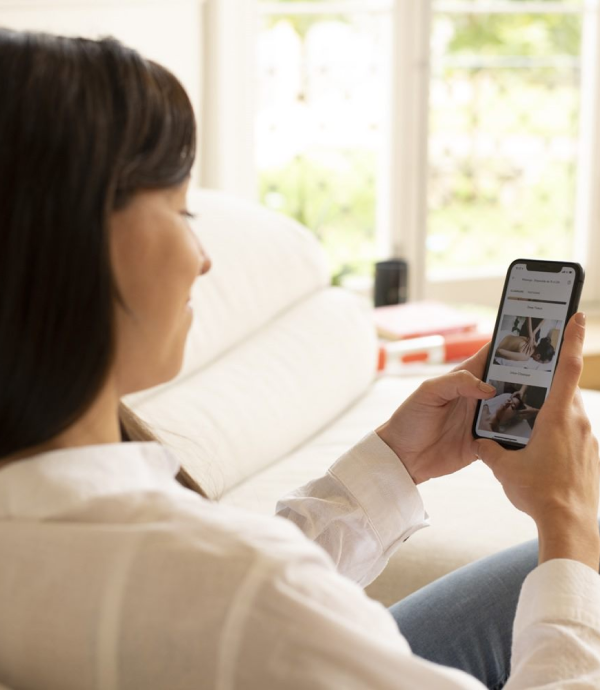 Smiling woman using a smartphone