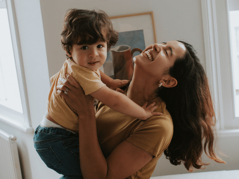 Toddler in mum's arms