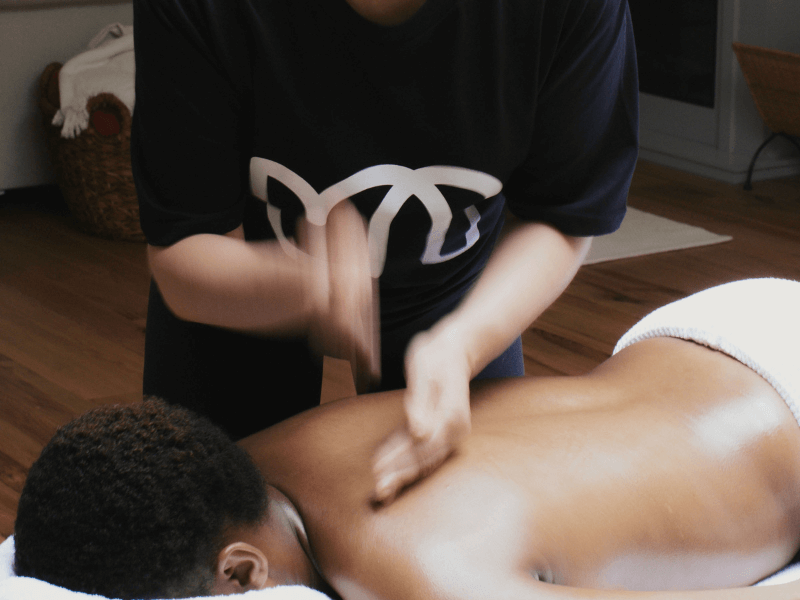 How does massage boost energy?