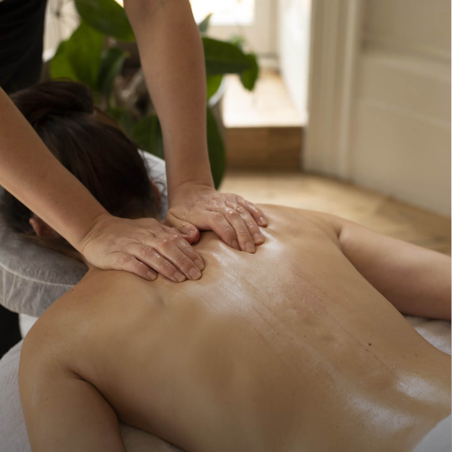 Image of a woman getting a massage at home