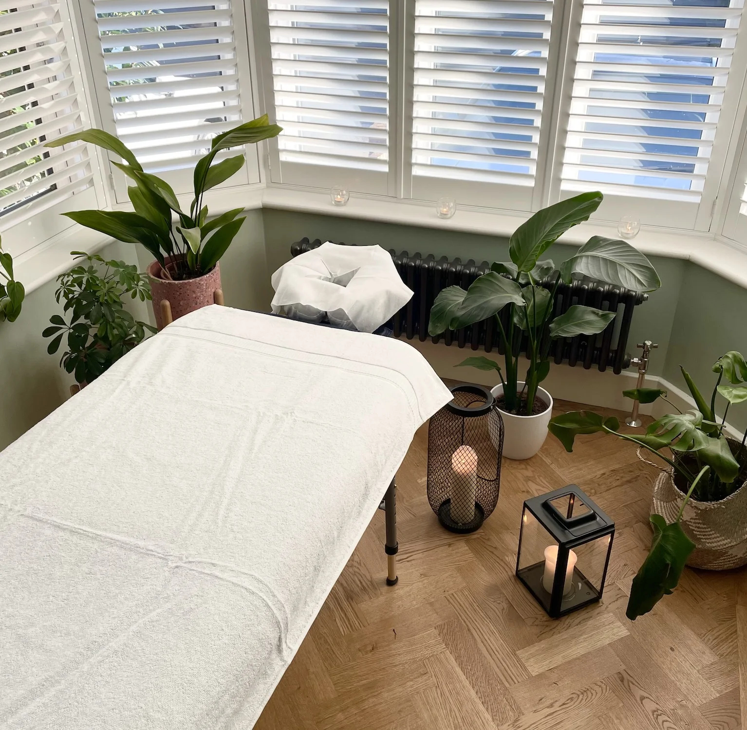Mobile massage table with towel in apartment window