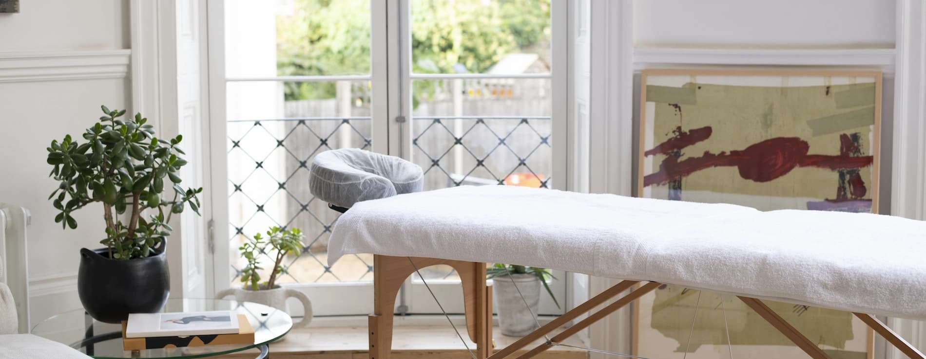 A massage table set up in a London apartment