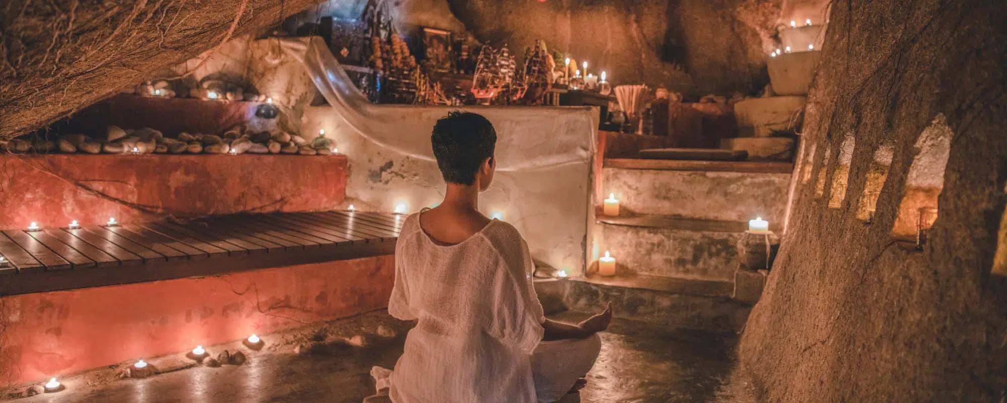 Candle-lit meditation in cosy Kamalaya retreat in Thailand