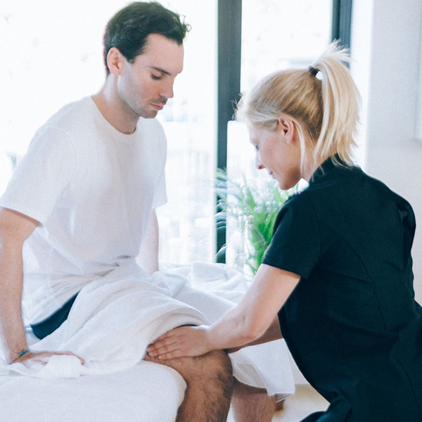 Sports massage therapist giving a remedial massage
