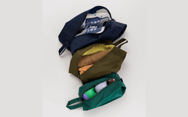 Three Baggu zip bags in navy, khaki and forest green