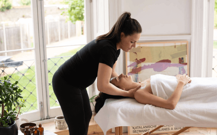 Busy person relaxes while she gets a mobile massage