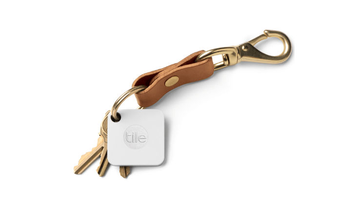 Set of keys with a tile bluetooth tag attached to help find them