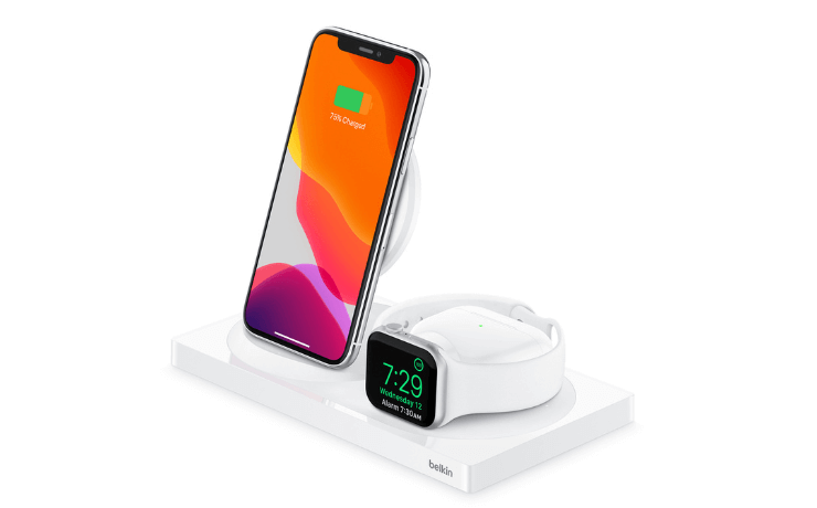 White wireless charging station by Belkin with iphone, airpods and apple watch on top