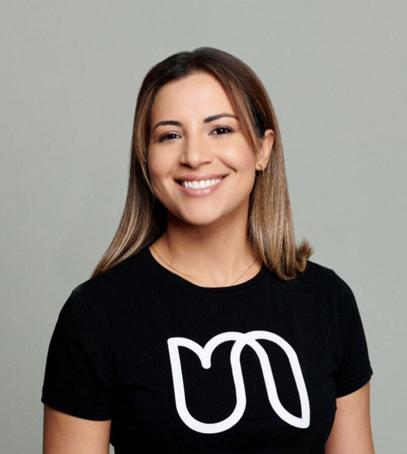Woman smiling wearing black t shirt with Urban logo